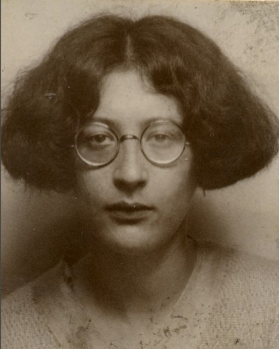 Simone Weil round glasses not smiling